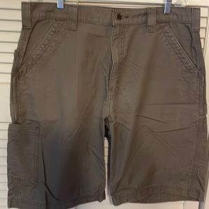 Brown Men’s Carhartt carpenter work shorts.